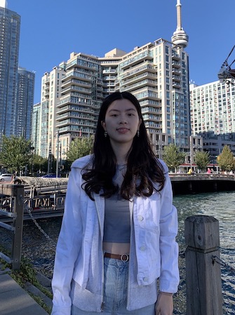 Irene standing on pier.